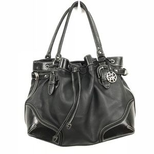 The Sak black pebbled + patent leather handbag